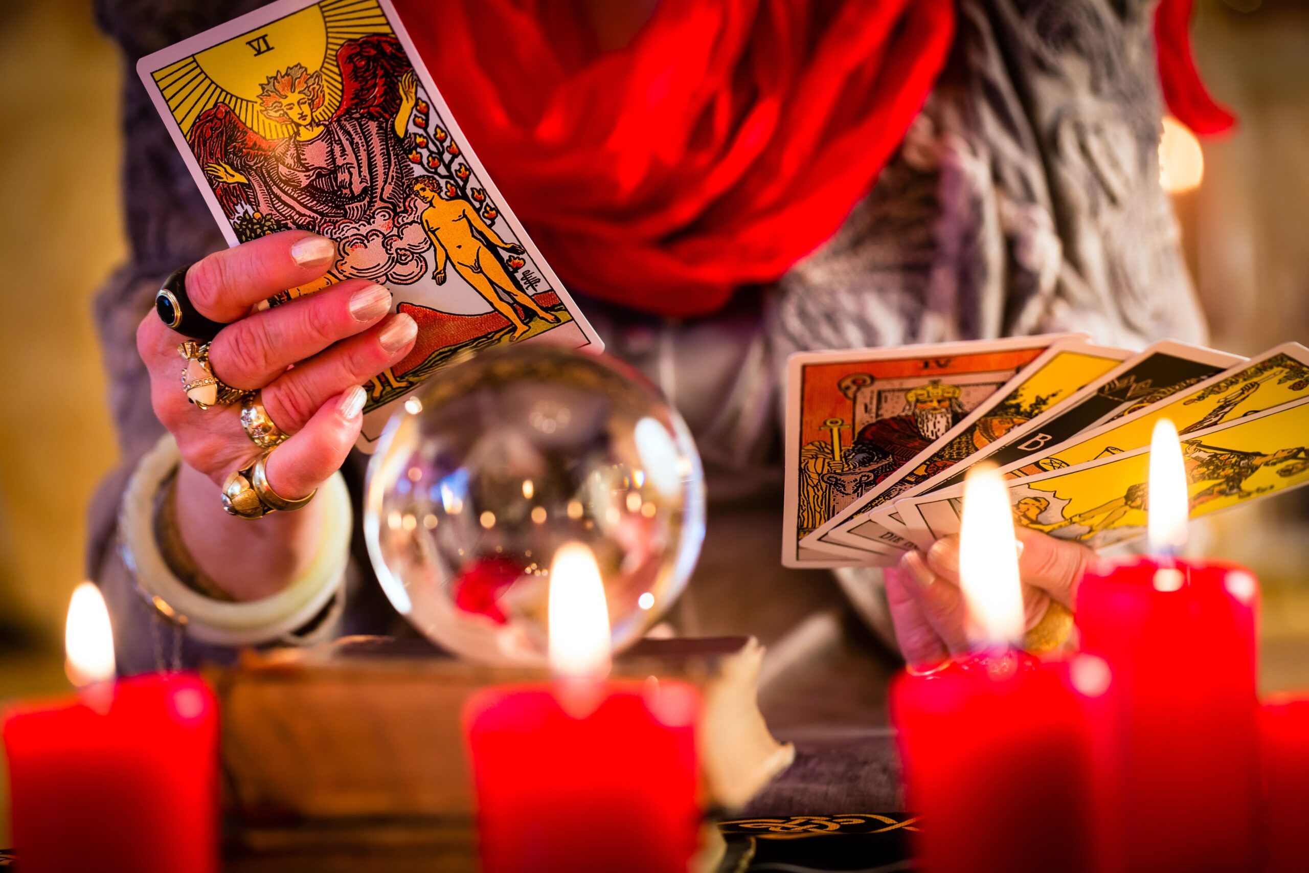 //infinitedivinemission.com/wp-content/uploads/2023/02/fortuneteller-during-session-with-tarot-cards-scaled.jpg